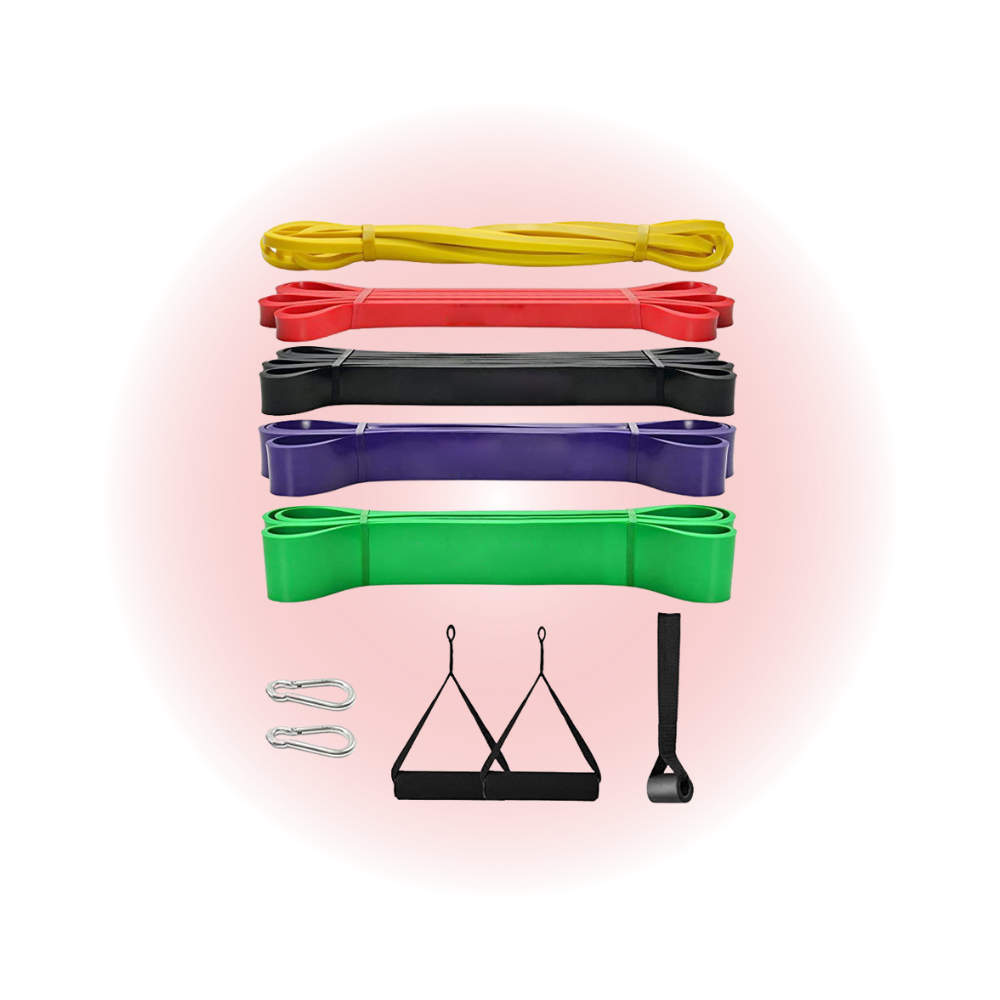Set of resistance bands in various colors with attachments on a pink background